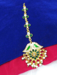 "Gilded Glamour: Trending Golden Maang Tikka Designs"